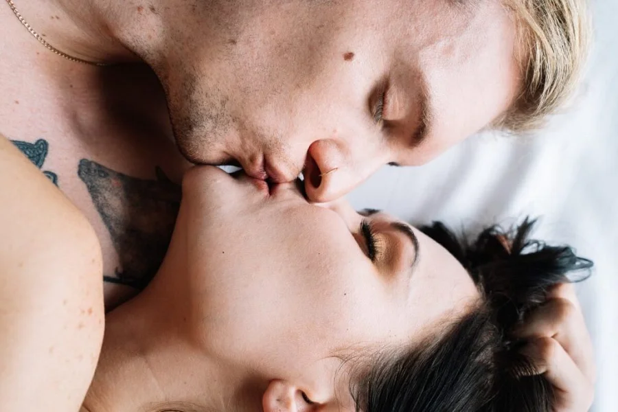 passionate kissing between a blond man and a woman